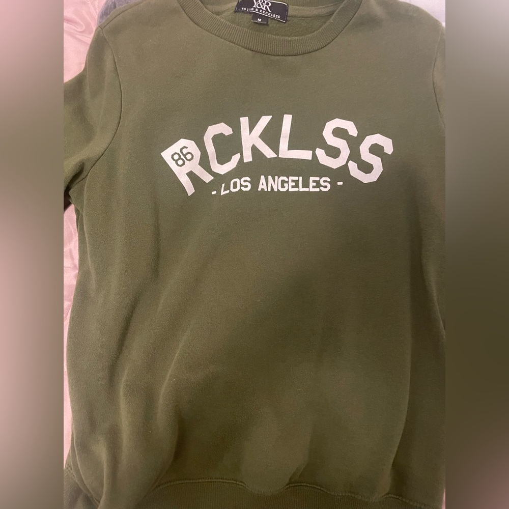 Young and reckless sweater